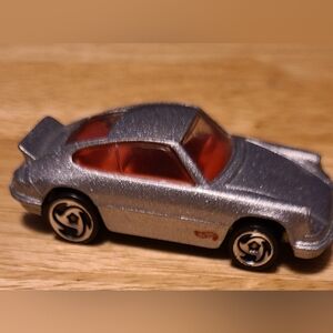 Sleek Silver Toy Car with Red Accents